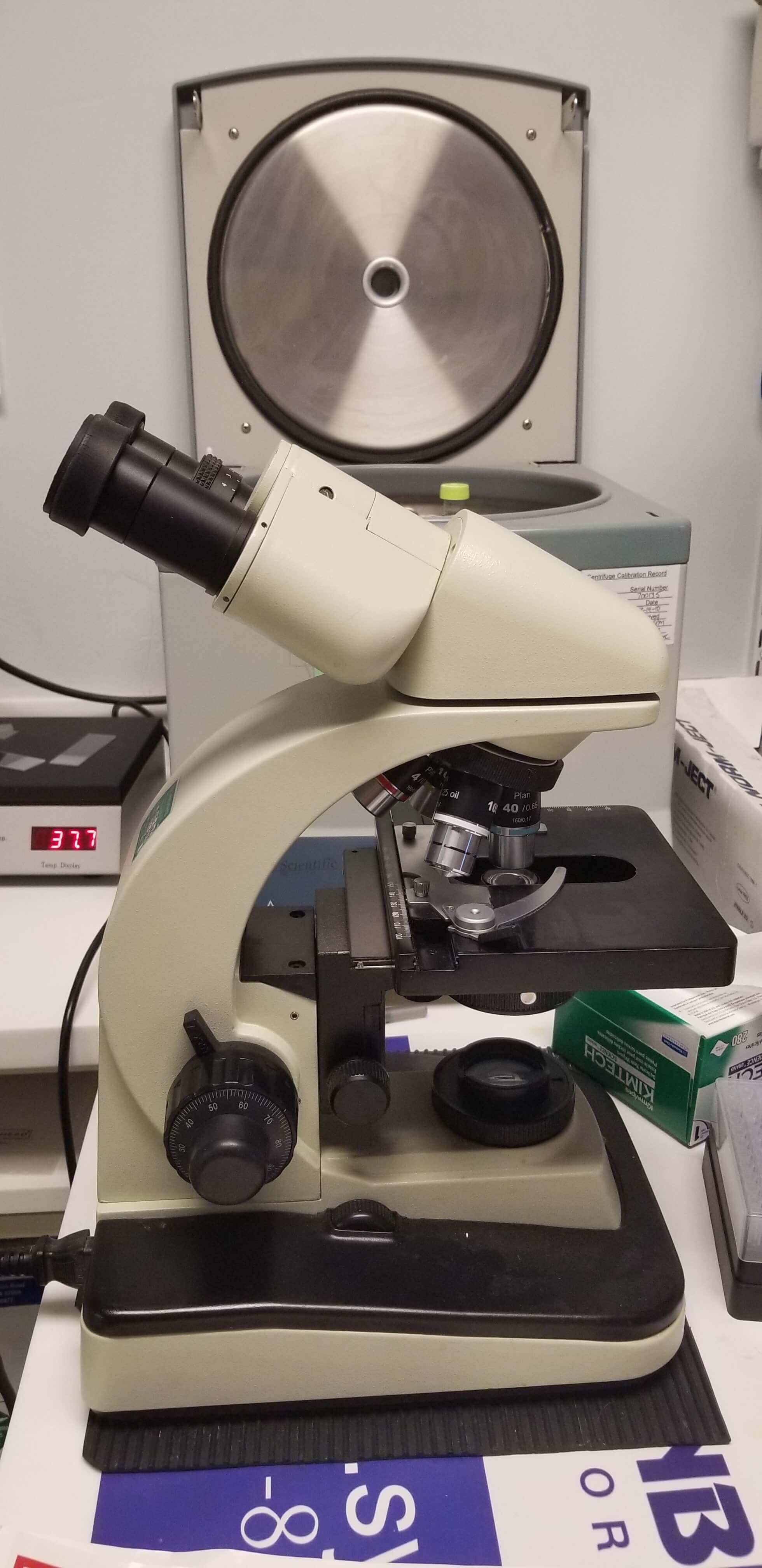 Microscope in front of a centrifuge 